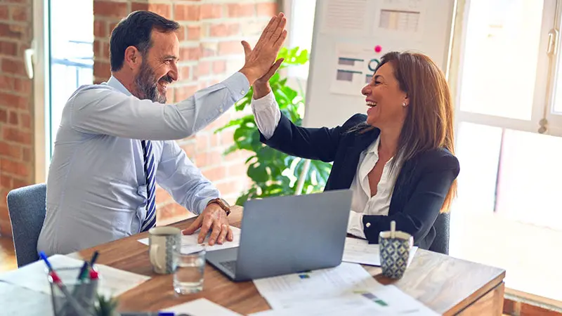 Two people doing a high five